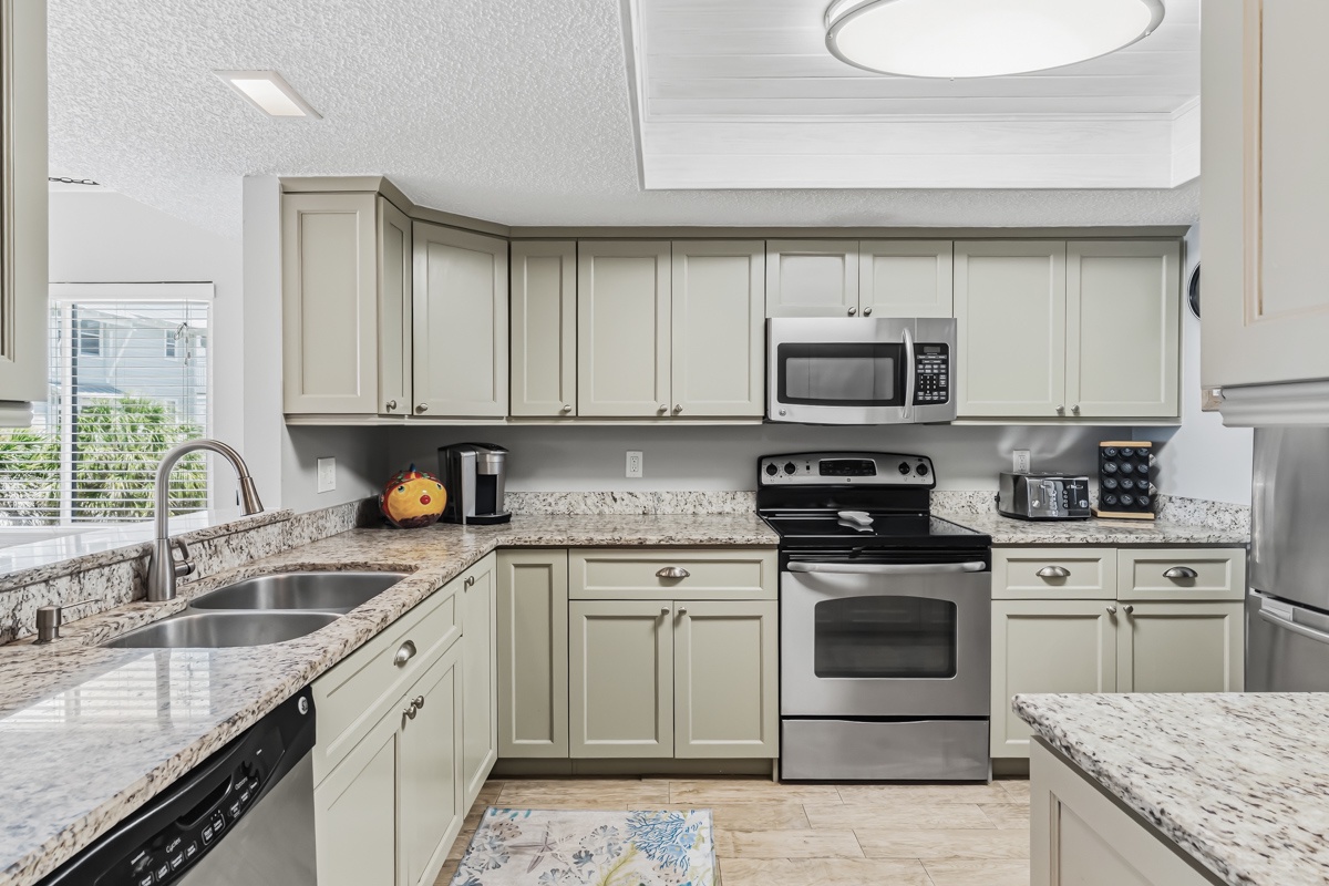 Your fully equipped kitchen awaits with granite counters, stainless steel appliances, and all the tools you need to cook your favorite meals in comfort and style.