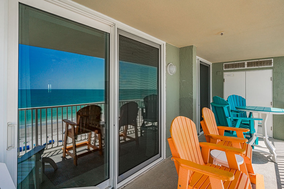 Soak up endless ocean views from your private beachfront balcony, with colorful Adirondack chairs perfect for morning coffee or sunset cocktails.