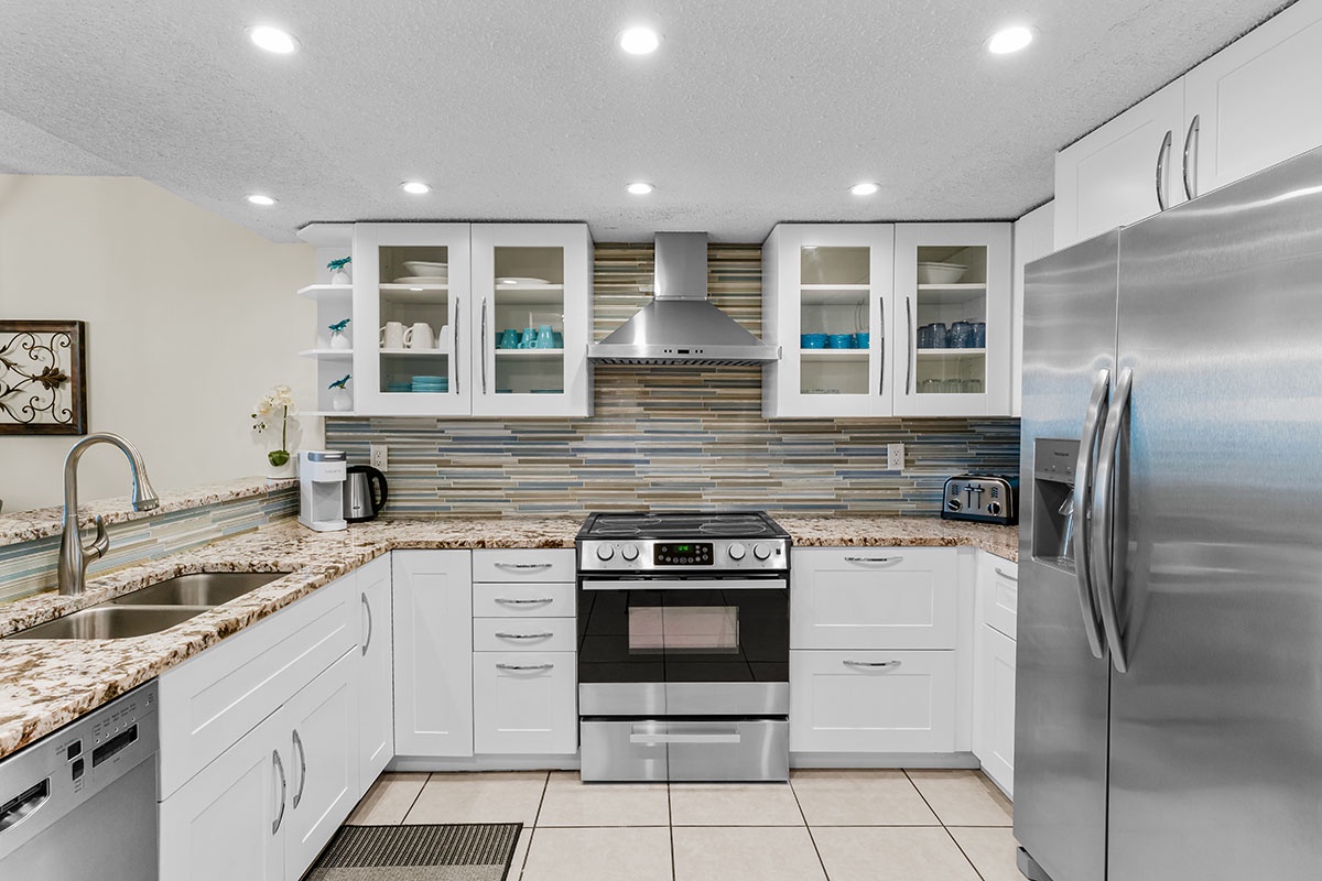 Your fully equipped kitchen features granite counters, stainless appliances, and glass-front cabinets for effortless meal prep.