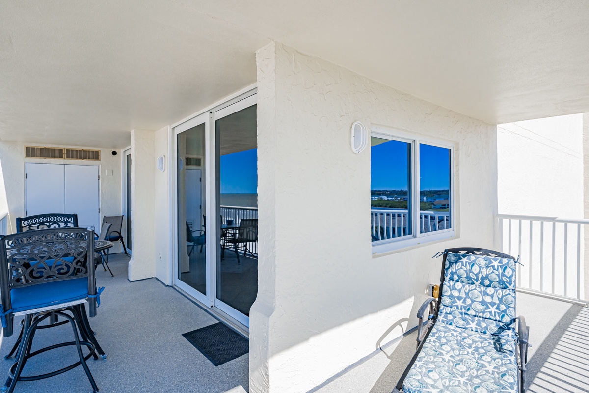 Corner wrap around balcony with comfortable seating and stunning water views..