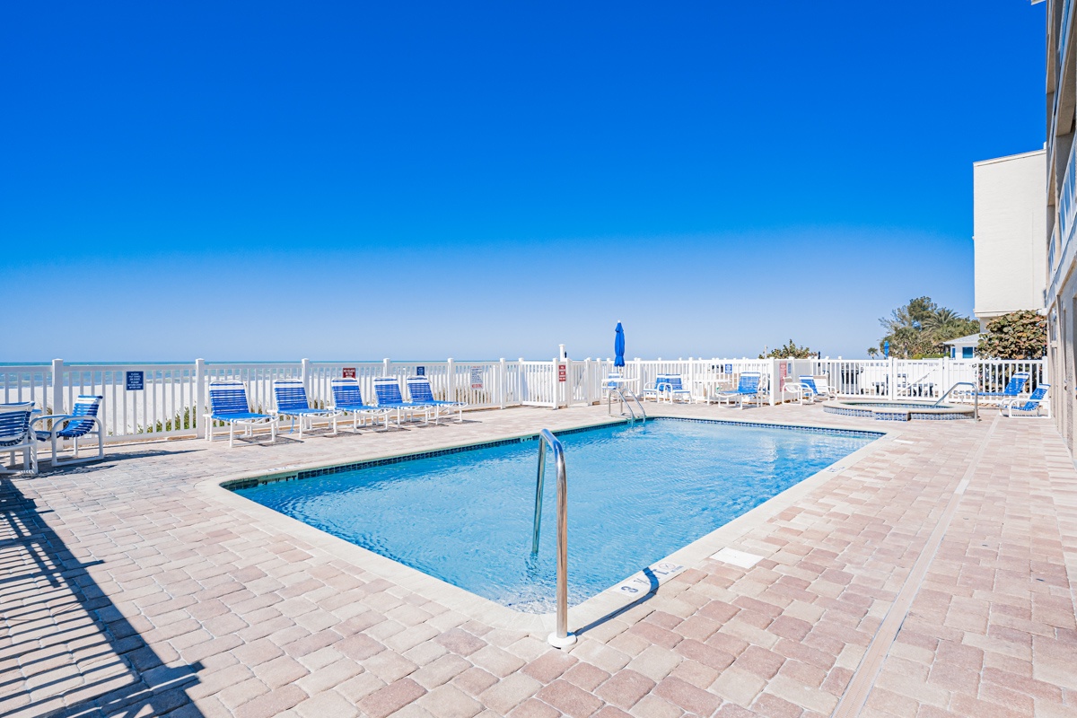 Dive into crystal-clear waters surrounded by comfortable loungers, with stunning ocean views stretching to the horizon from your poolside retreat.