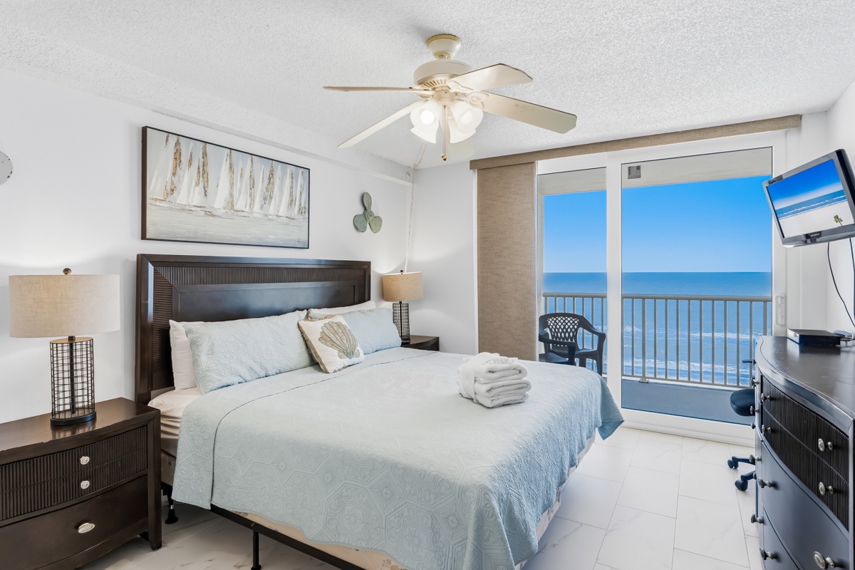 Wake up to endless ocean views from your comfortable bed, where the sea breeze flows through your private balcony doors.
