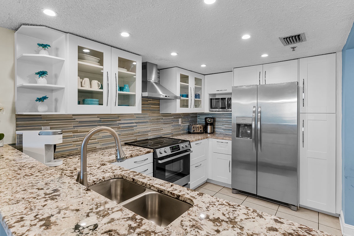 Your modern kitchen features granite countertops, stainless appliances, and everything you need to create memorable meals during your stay.