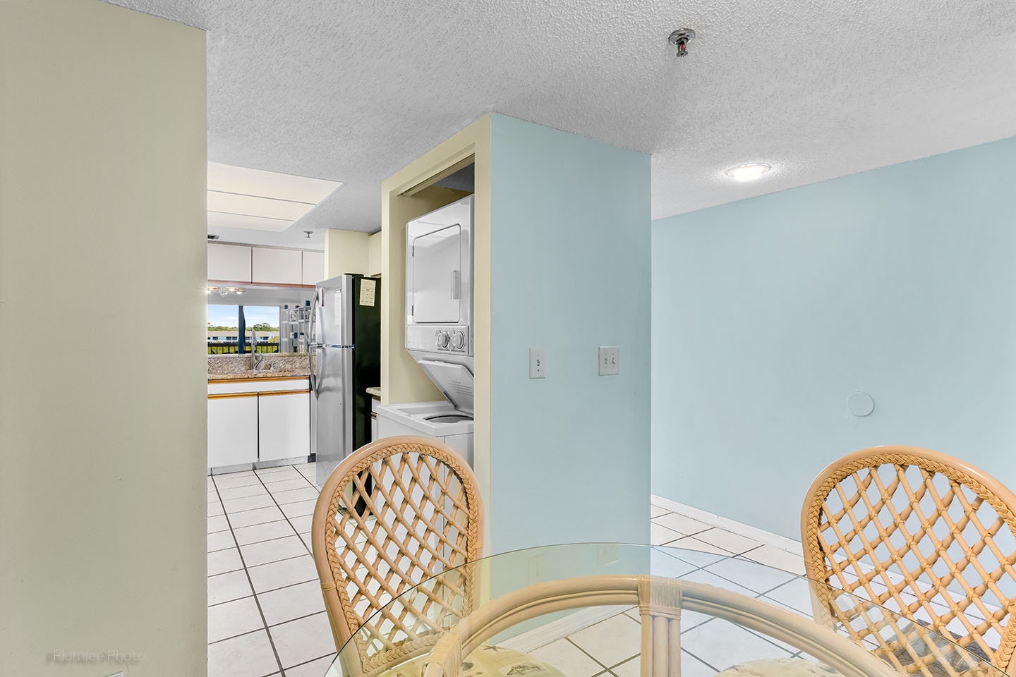 View of the kitchen from the breakfast nook goes all the way to the living room sliders.