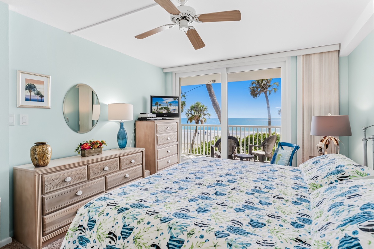 Wake up to the soothing sound of waves and your own private ocean view. This tranquil King bedroom opens directly onto a balcony where swaying palms and endless blue horizons set the tone for your perfect beach getaway.