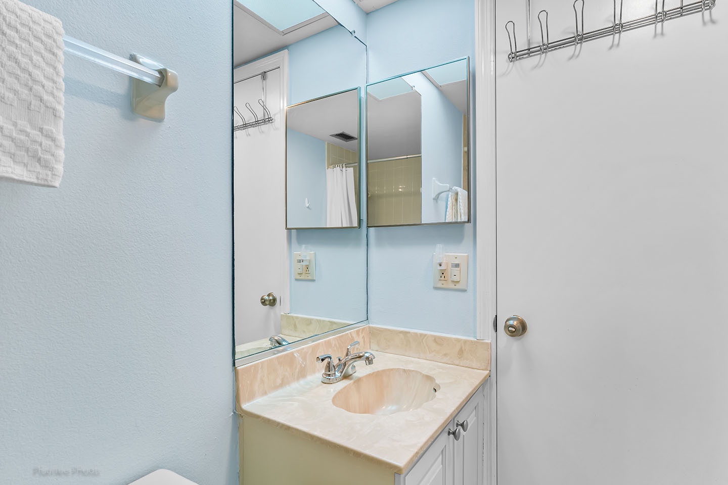 The vanity area of the hallway bathroom.