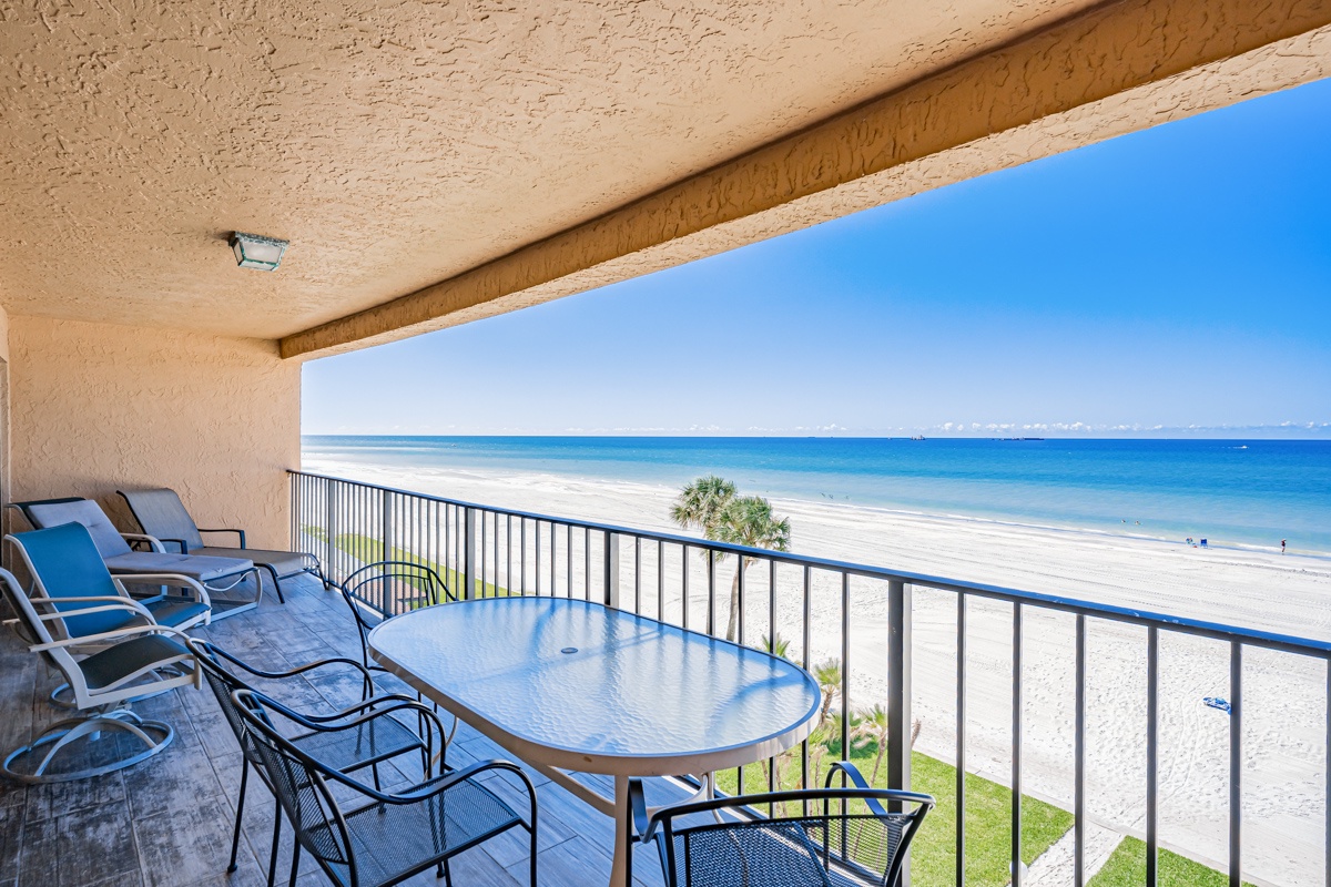 Large private balcony overlooking sugary sand beach