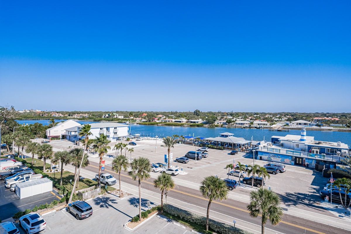 Waterfront paradise with marina access and tropical palm-lined streets in a charming coastal community.