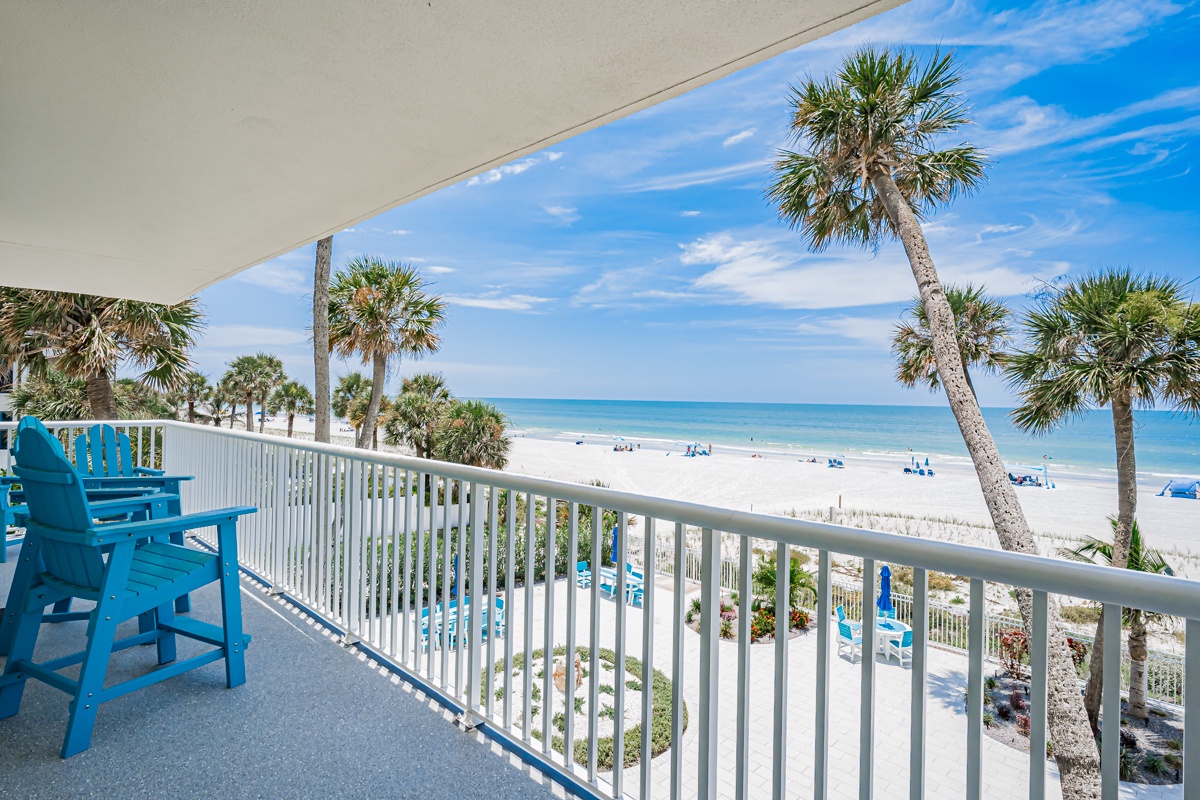 Step out onto your private balcony and take in the stunning beachfront vista, where swaying palms frame white sand and turquoise waters stretching to the horizon.