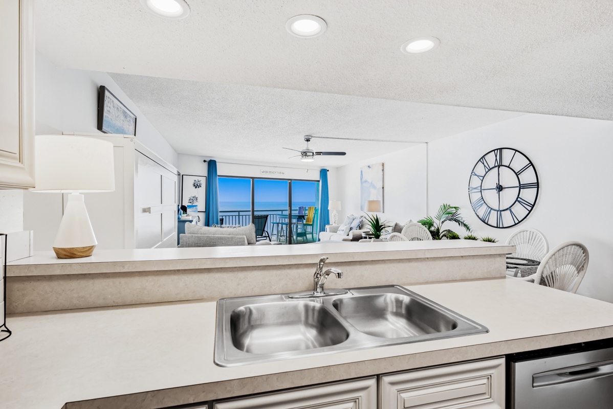 Your open-concept kitchen overlooks stunning ocean views, where cooking becomes a pleasure with sparkling blue waters as your backdrop.