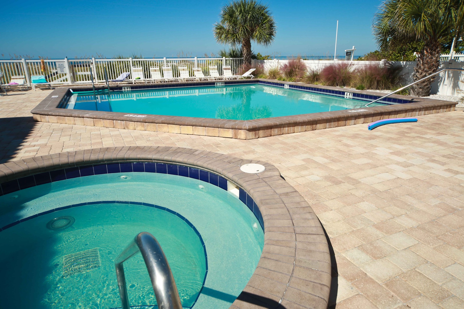 Soak in turquoise waters, rinse off in the main pool, and lounge on sunny pavers just steps from the dunes and sea. Swaying palms and gentle breezes complete your beachside escape.