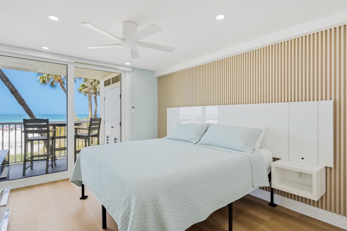 Wake up to ocean views from your comfortable bed, with palm trees swaying just beyond your private balcony.