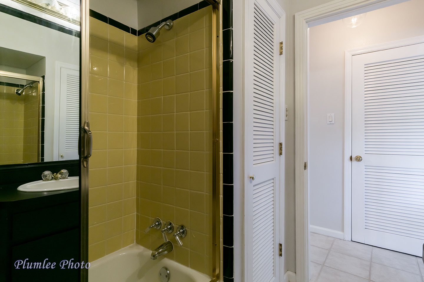 A bathtub with shower.