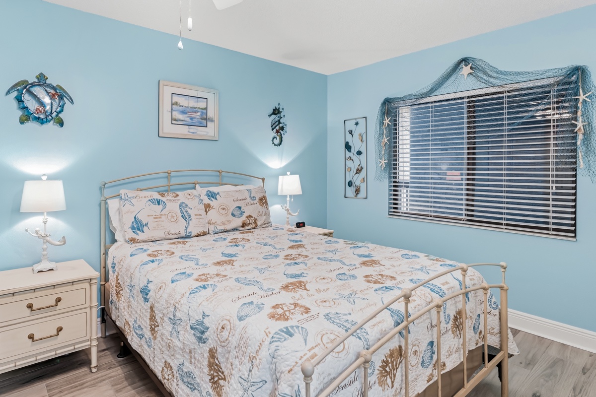 Drift off to the sound of the waves in your coastal-inspired Queen bedroom, where soft blue tones and beachy décor invite total relaxation and a restful night's sleep.