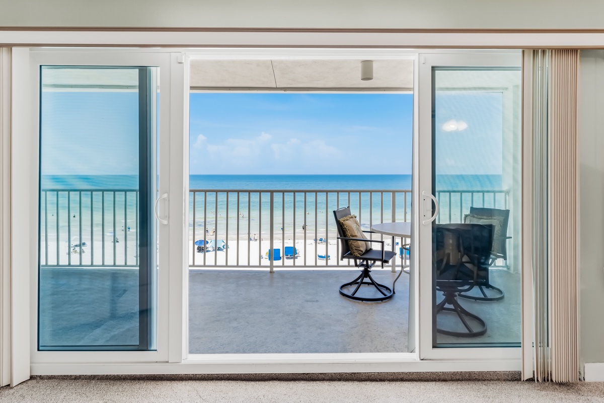 Your private balcony awaits with beach chairs perfectly positioned for soaking in the endless ocean views and feeling the sea breeze.