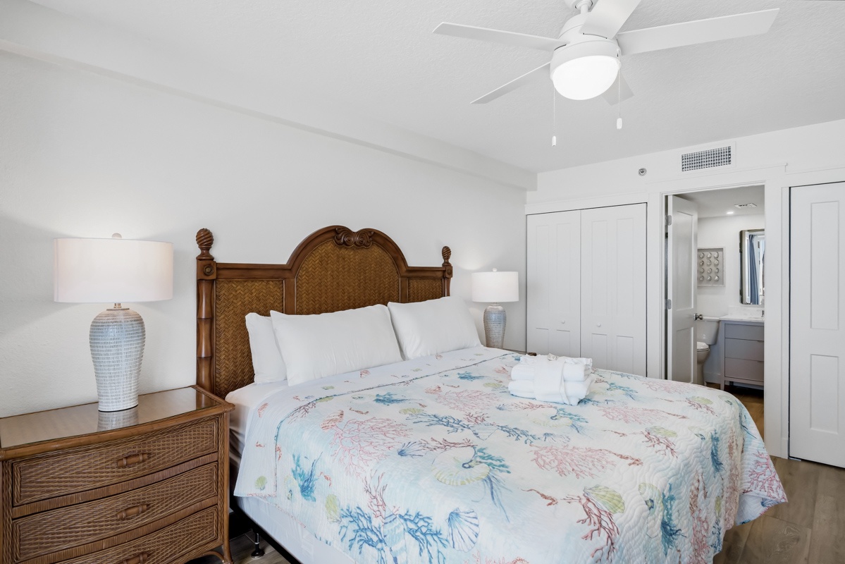 Sink into soft linens and coastal charm in your serene bedroom retreat, complete with tropical touches and ensuite convenience.