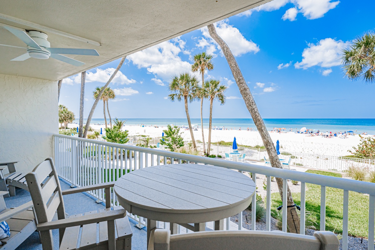 Wake up to stunning ocean views from your private balcony, where palm trees frame pristine white sand and turquoise waters.