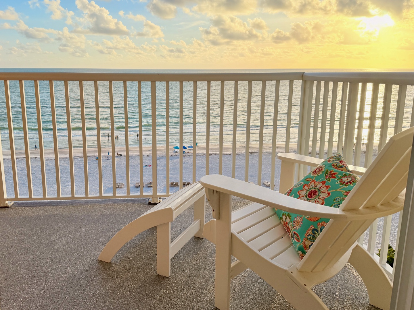 Your private beachfront balcony features a comfortable chair perfect for savoring sunrise coffee or sunset cocktails. Watch gentle waves roll in and feel the ocean breeze as you unwind in this serene Gulf-side retreat.