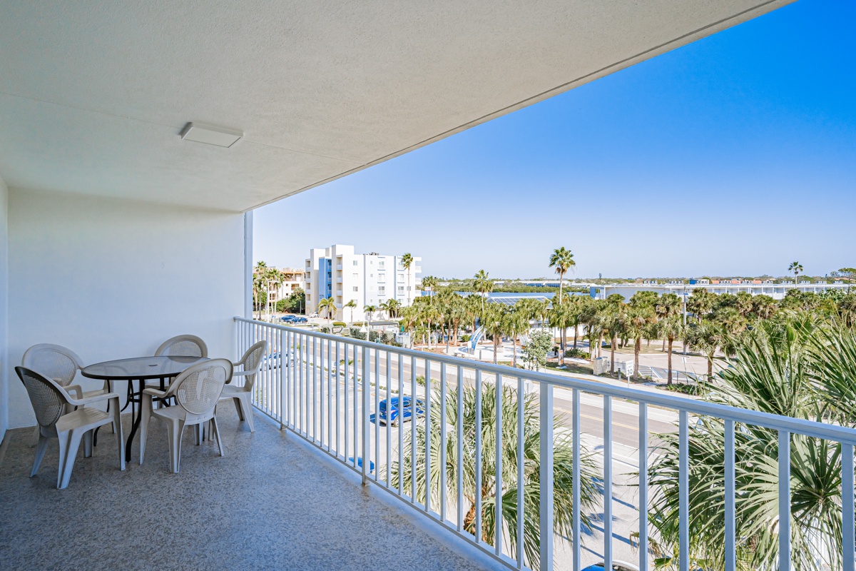 Sip your morning coffee on your private balcony while soaking in panoramic views of swaying palms and sparkling water beyond.