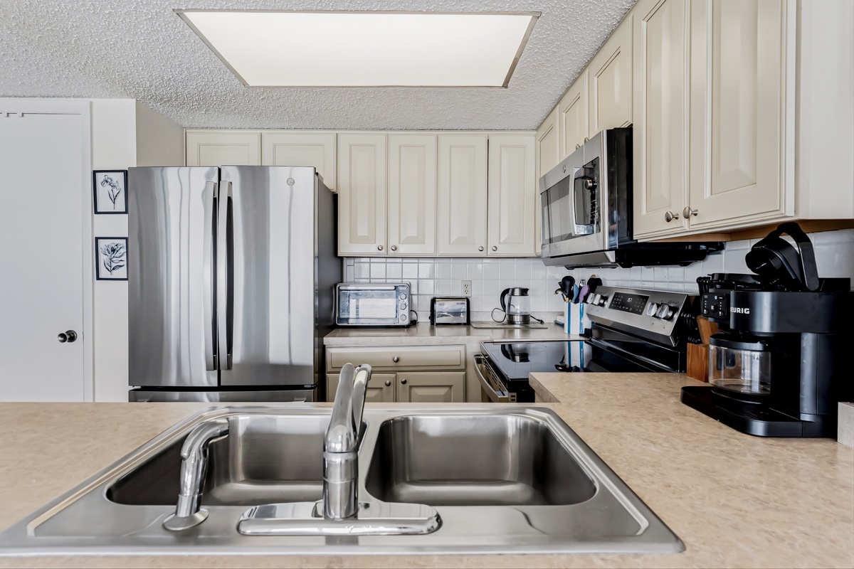 Your fully equipped kitchen awaits, complete with stainless steel appliances, ample counter space, and everything you need to whip up your favorite meals during your stay.