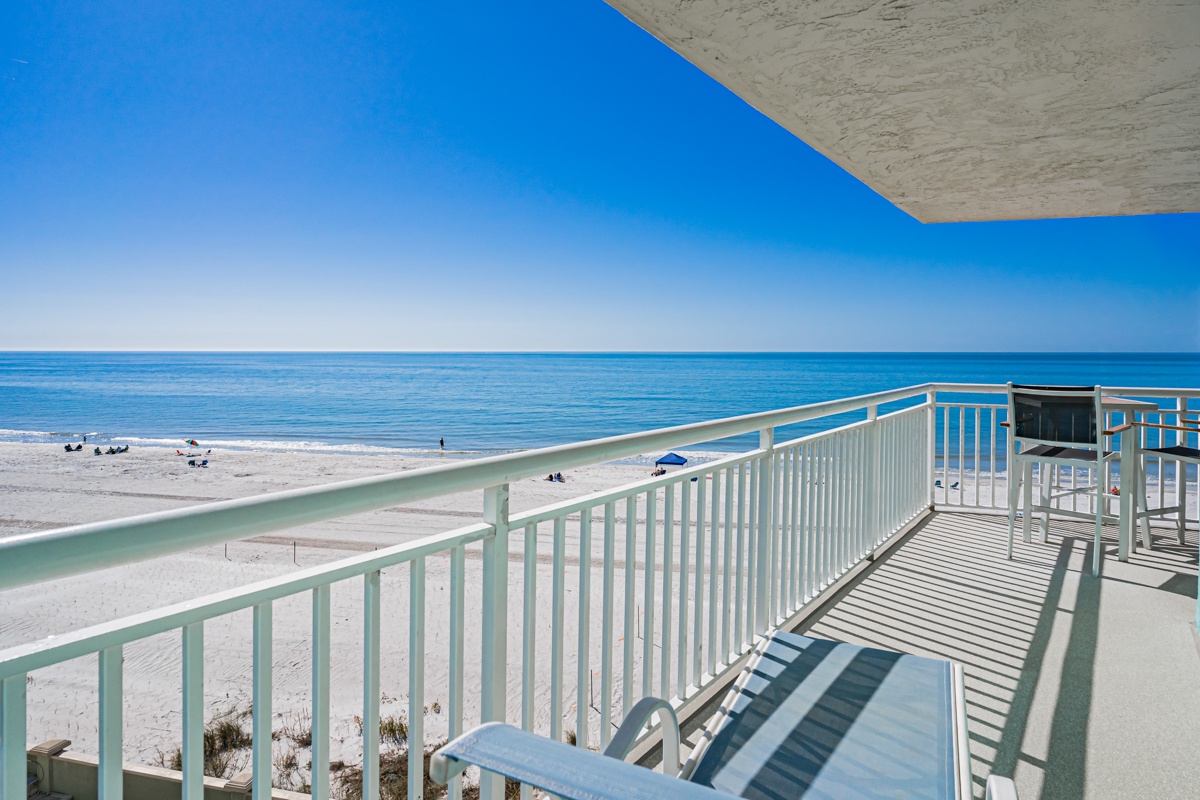 Wake up to endless ocean views from your private balcony, where morning coffee tastes better with sand and surf stretching before you.