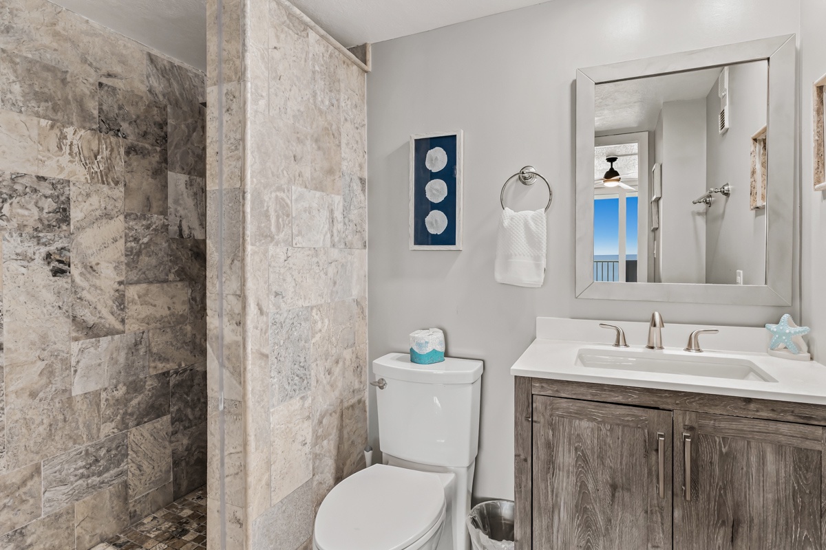 Freshen up in your elegantly appointed Primary ensuite bathroom, complete with a spacious walk-in shower and coastal touches that capture the spirit of relaxation.