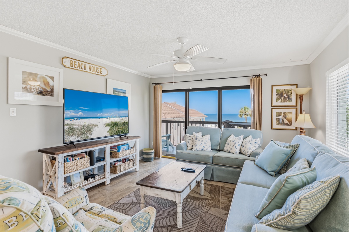Sink into coastal comfort in your inviting living space, where soft ocean breezes and stunning sea views create the perfect backdrop for your unforgettable beach getaway.