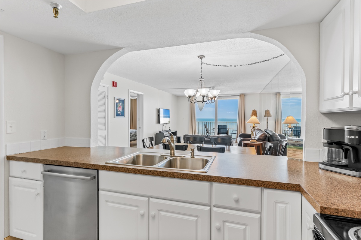 Your fully equipped kitchen seamlessly flows into a bright living area with stunning ocean views beckoning from every window.