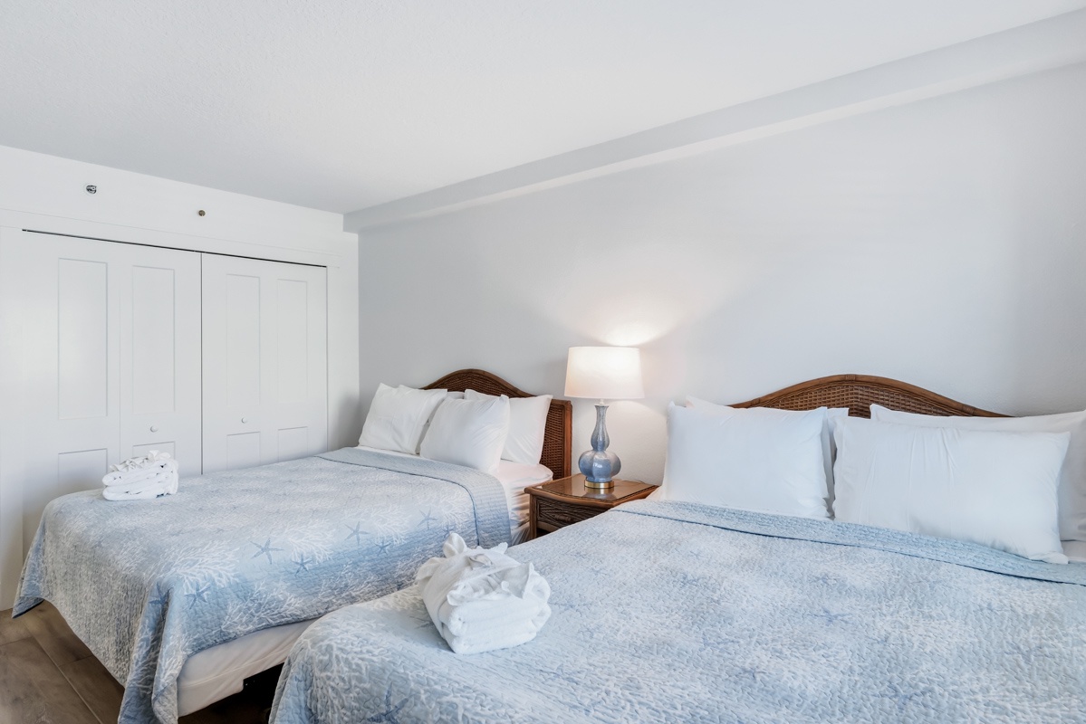 Sink into crisp linens and soft blue bedding in your Queen bedroom, where thoughtful touches create a peaceful retreat.