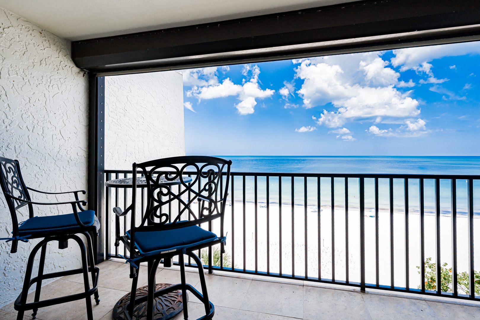 Step onto your private balcony and soak in breathtaking views of turquoise waters meeting endless sky—your perfect spot to unwind with morning coffee or watch clouds drift by.