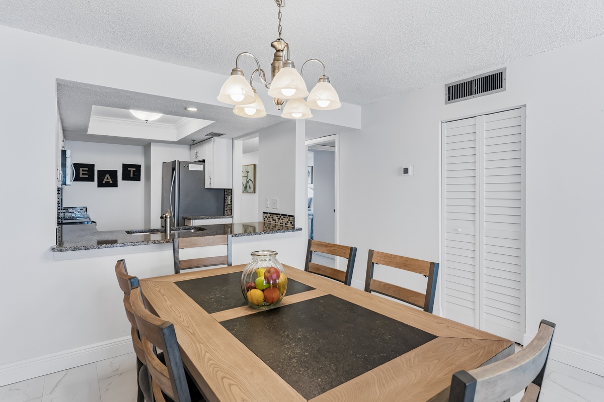 Gather around your elegant dining table where meals become memories, with an open kitchen perfect for socializing while you cook.