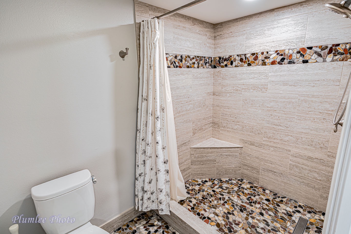 Very cool stone tile flooring in shower.