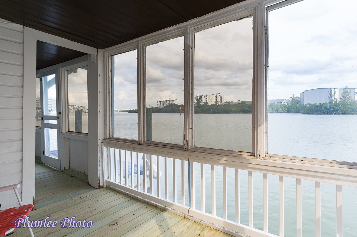The 1st Floor screened in Porch runs the length of the house along the water.