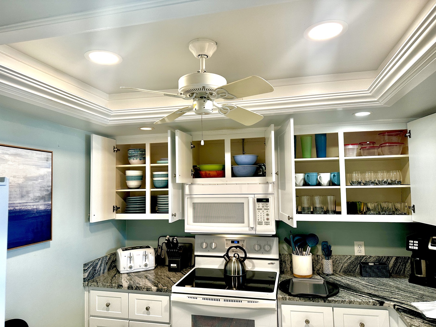 Your fully equipped kitchen features granite countertops, modern appliances, and plenty of cabinet space for preparing delicious vacation meals together.