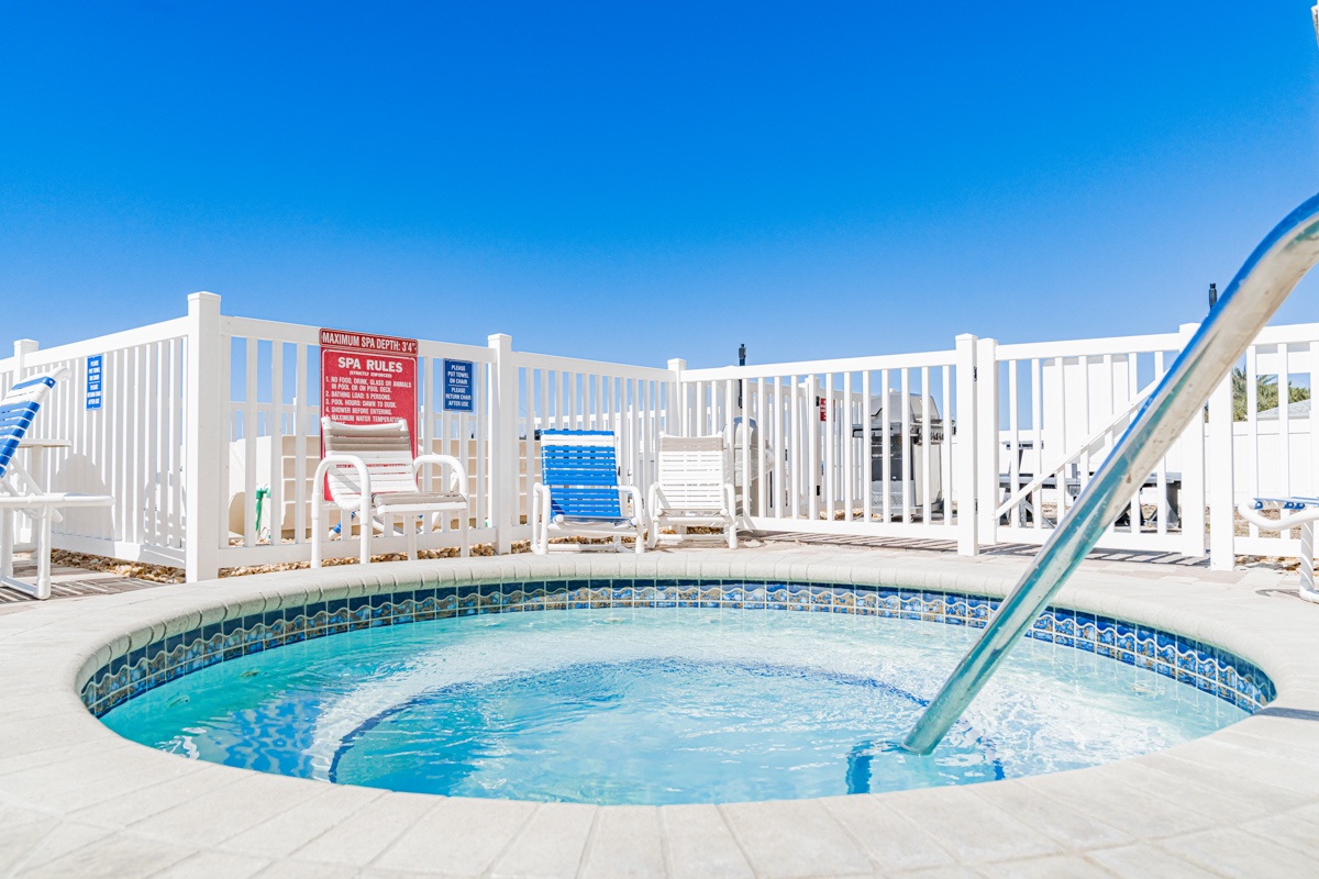 Soak your worries away in the bubbling hot tub, then cool off with a refreshing swim in the sparkling pool nearby.