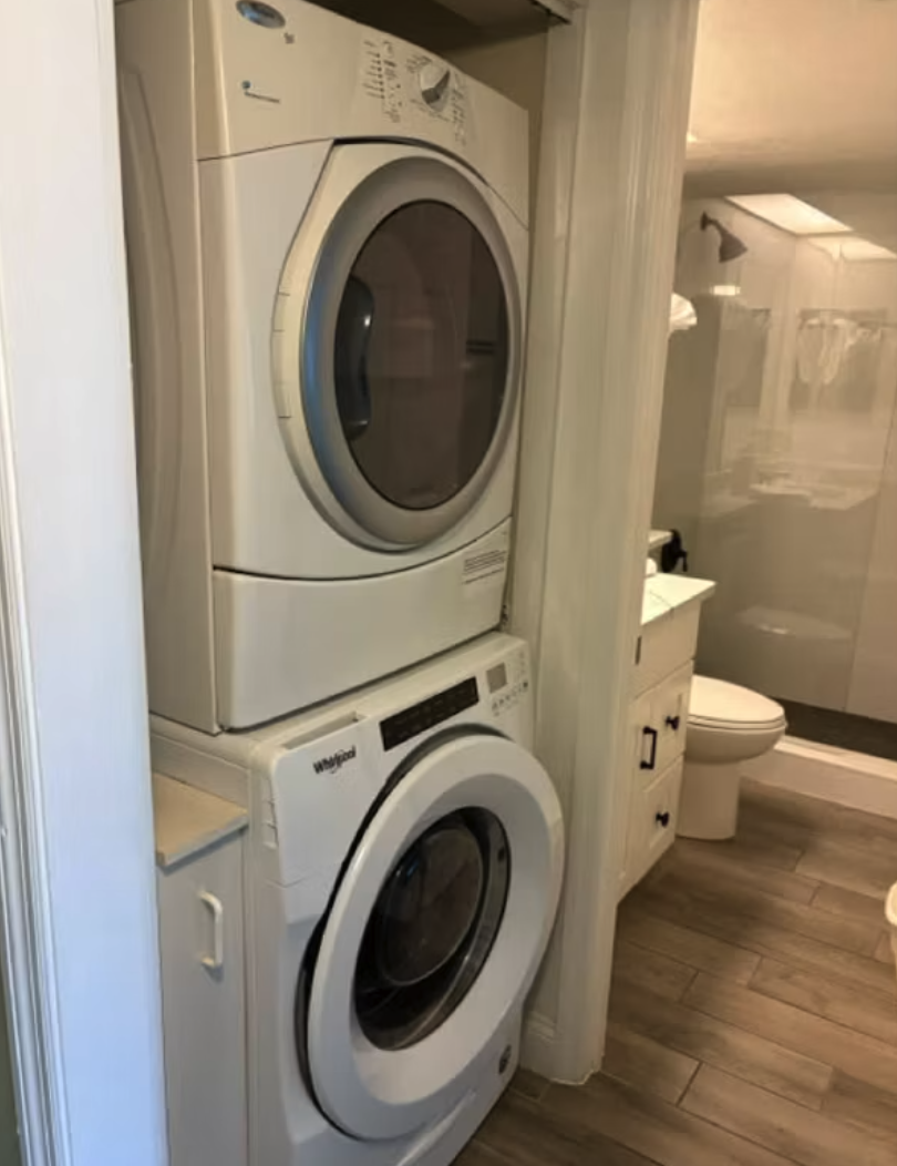 Your own in-unit washer and dryer make extended stays effortless, tucked neatly in a closet near your private bathroom for ultimate convenience.