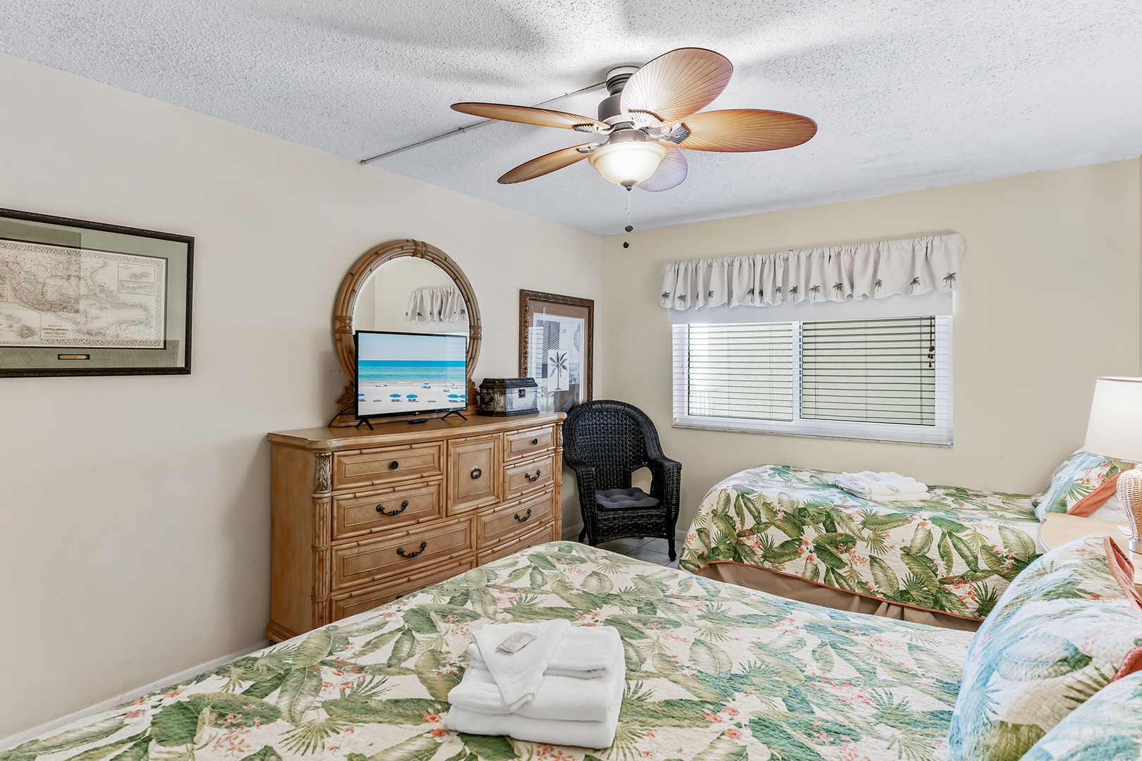 2nd bedroom has ceiling fan and TV