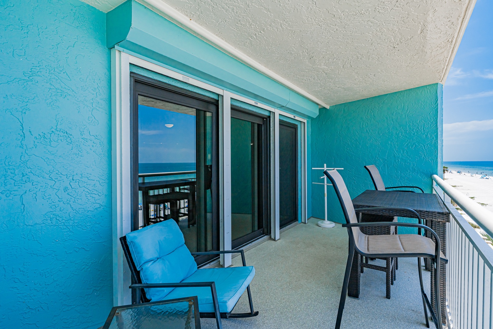 Relax on your private balcony with oceanfront views, comfortably furnished for soaking up the coastal breeze. Step outside to your own beachside escape anytime.