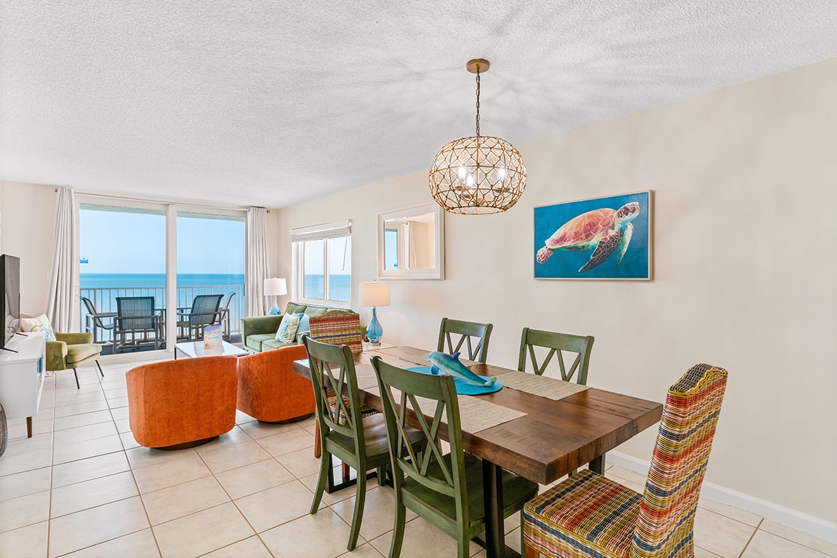 Gather around your beautiful dining table while the sea breeze flows through open balcony doors, creating perfect moments for shared meals.
