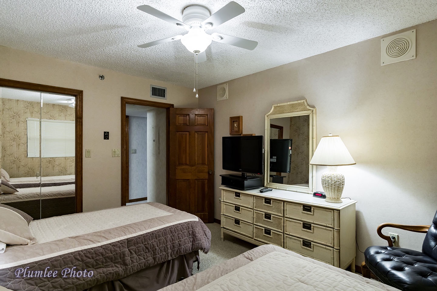 2nd Bedroom has plenty of storage in a large dresser.