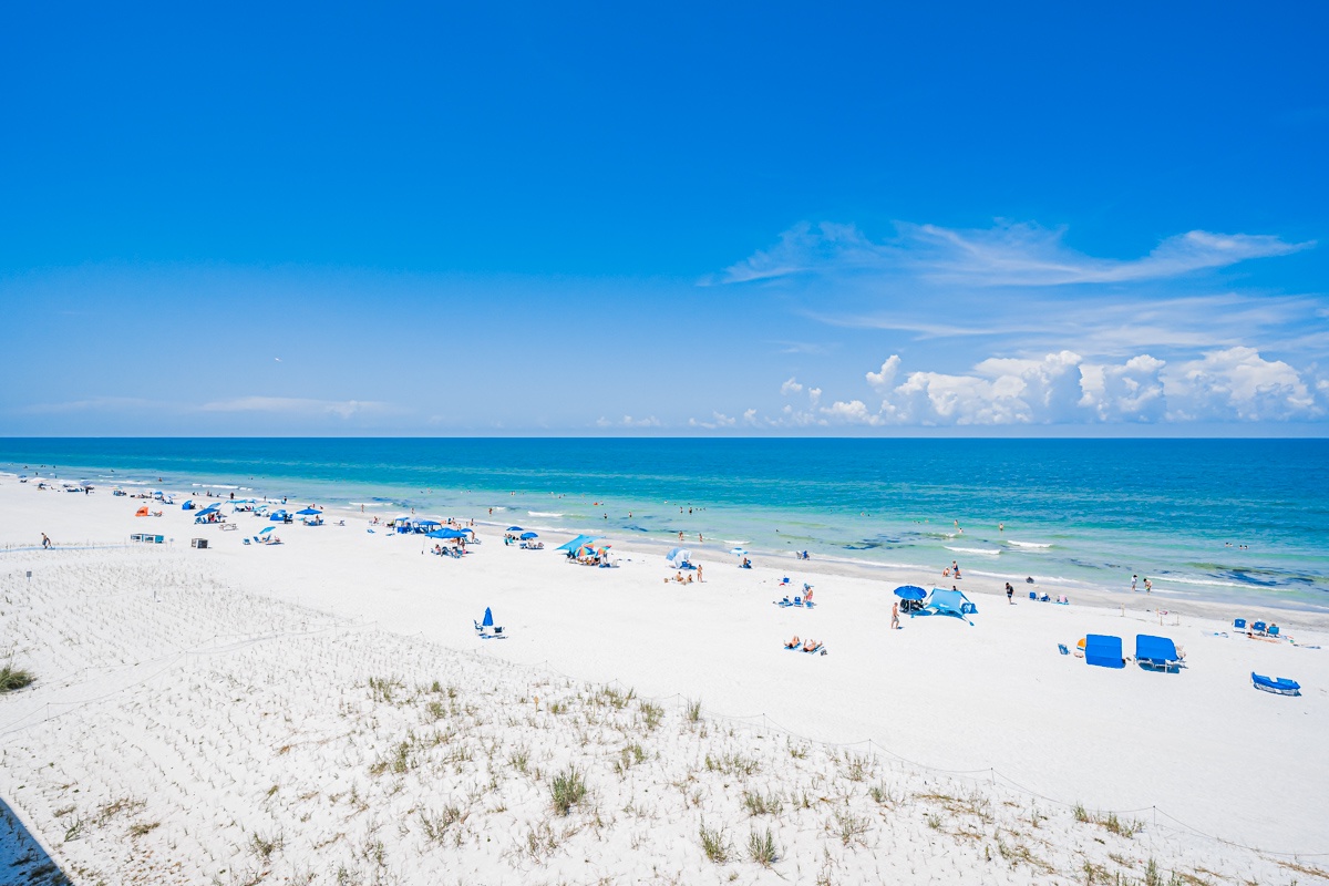 A stunning white-sand beach stretches along turquoise waters, just moments from your door. The soft sand and gentle waves create the perfect spot for your coastal retreat.
