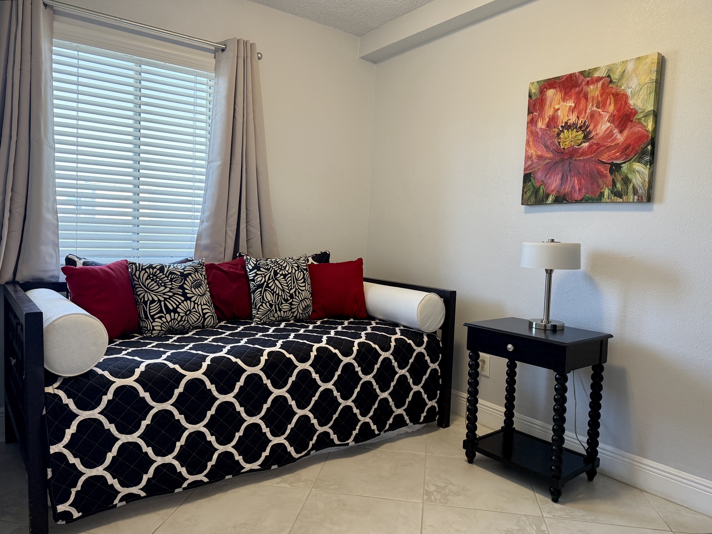 Unwind in your cozy reading nook with plush daybed, perfect for afternoon relaxation or curling up with a good book.