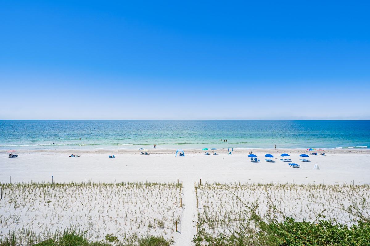 Pristine sandy shores meet sparkling turquoise waters, creating the perfect backdrop for your unforgettable beach getaway. Just steps from your rental, this idyllic coastline invites you to unwind and soak in coastal beauty.