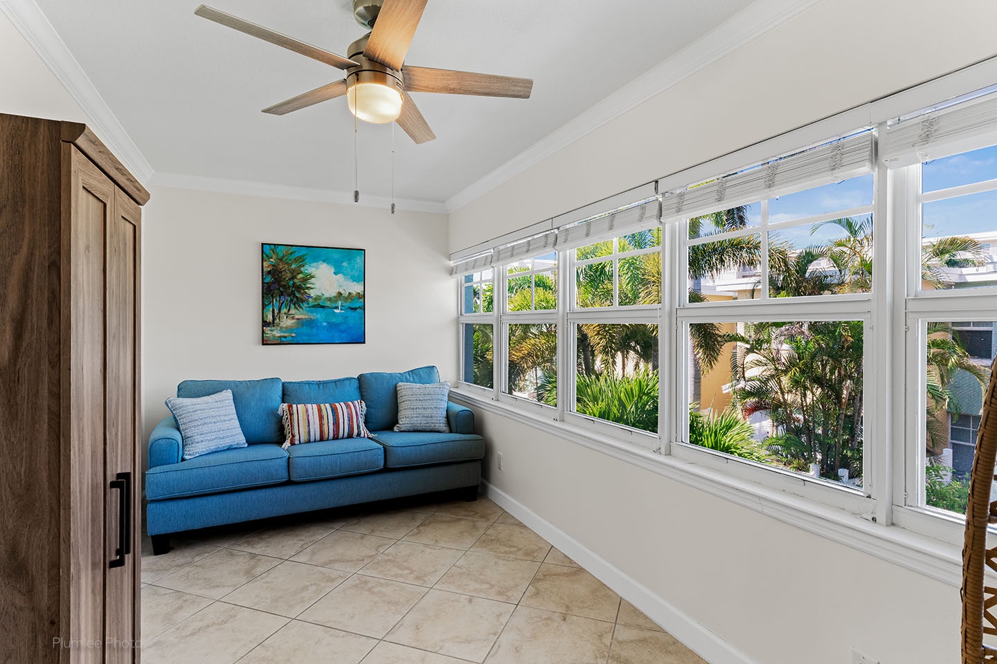 Den has a sleeper sofa and ceiling fan
