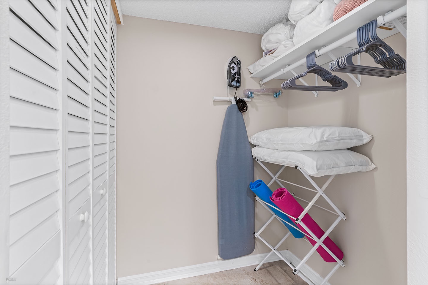 Master bedroom walk-in closet off bathroom.