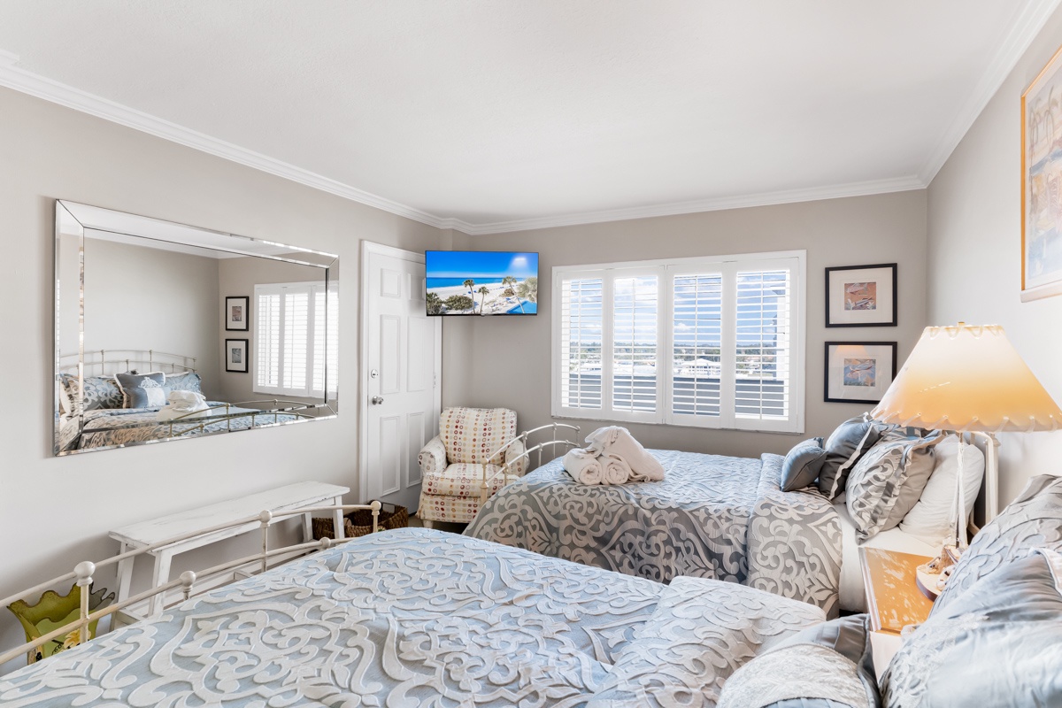 Relax in your cozy bedroom with Double beds, soft linens, and warm lighting for a perfect night's rest.