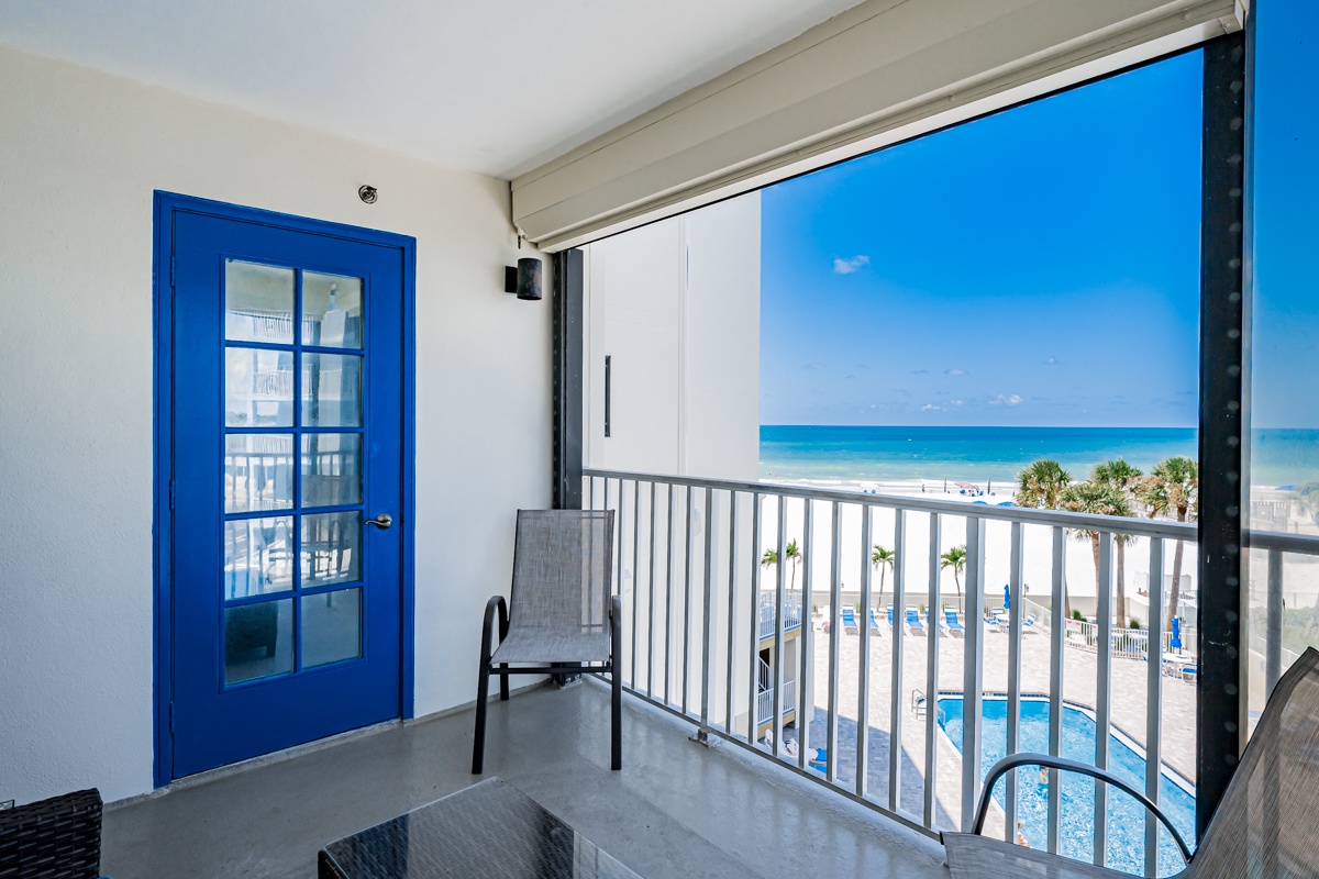 Step onto your private balcony and take in the stunning beachfront views, where soft white sand meets turquoise water and swaying palms frame the horizon.