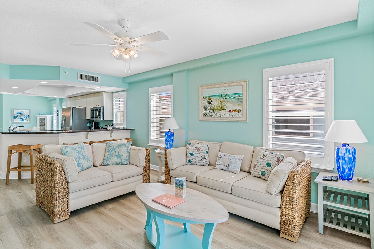 Relax in your coastal-inspired living room where soft blues and natural textures create a serene atmosphere for unwinding after beach adventures.