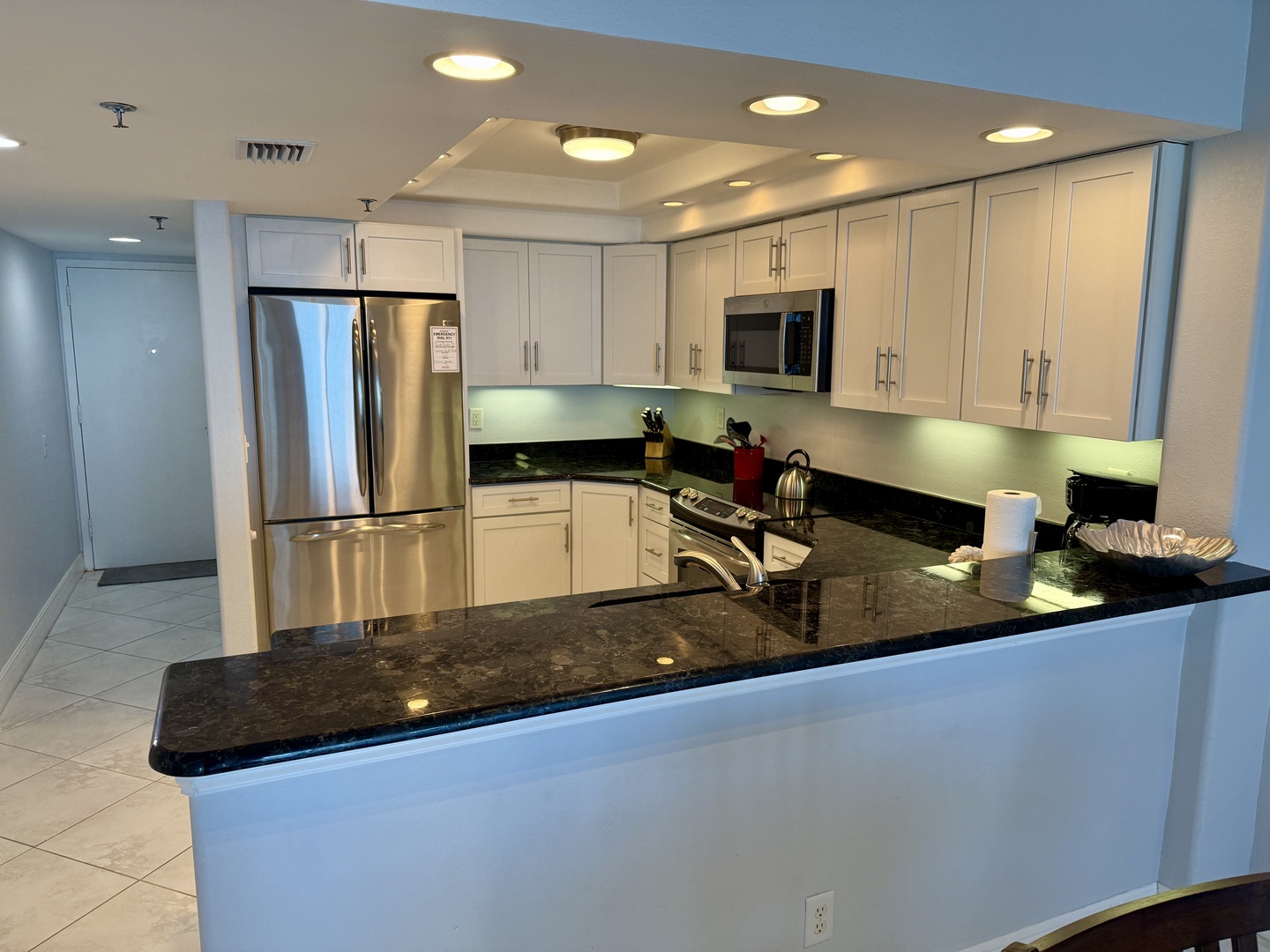 Your gourmet kitchen features granite countertops, stainless steel appliances, and ample space for preparing memorable meals during your stay.