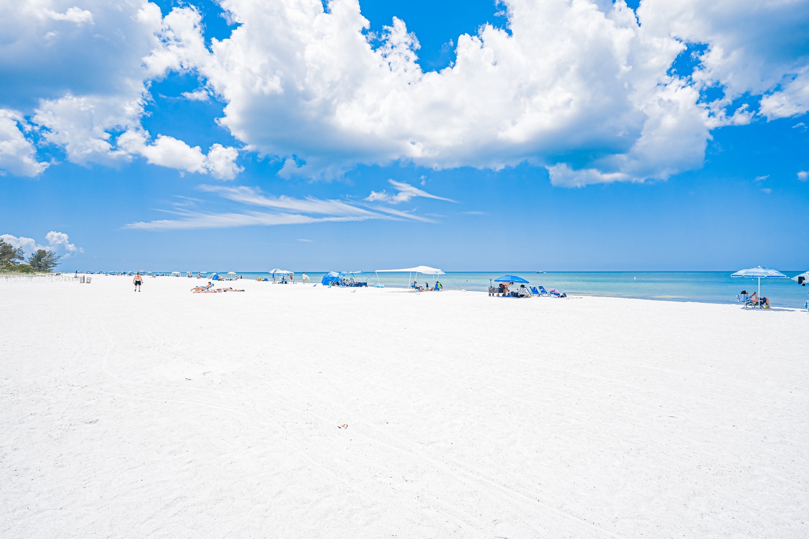 Pristine white sands meet turquoise waters under blue skies—perfect for leisurely beach days and coastal relaxation near the property.